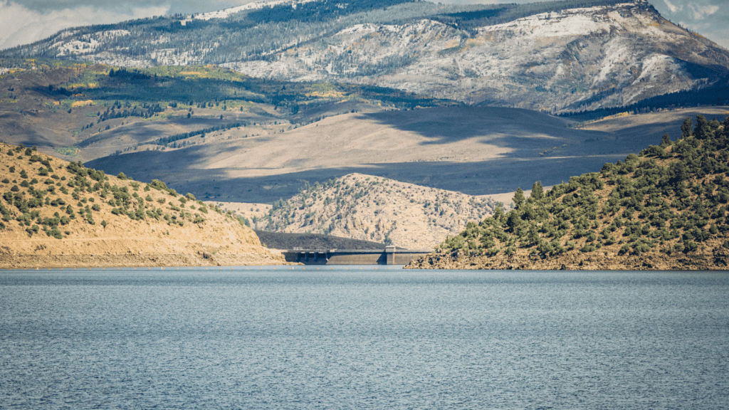 A large body of water with mountains in the background.