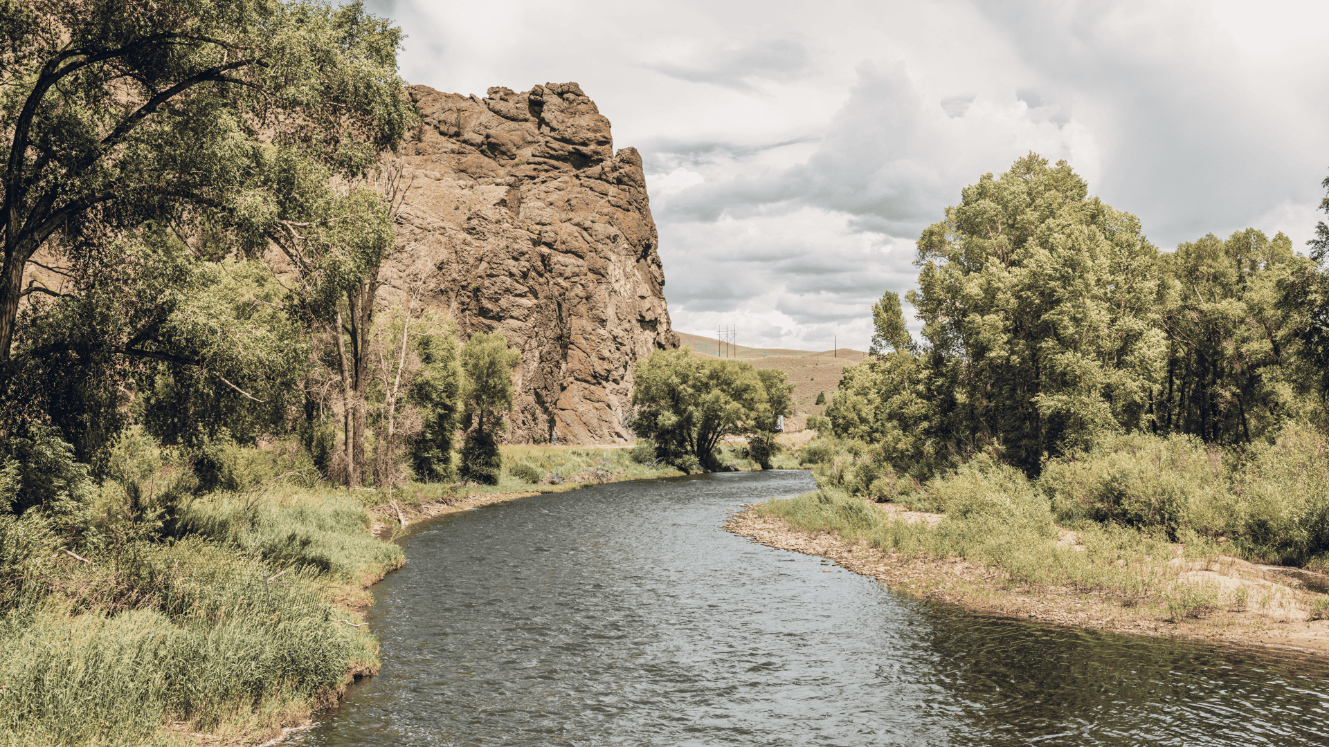 A river surrounded by trees and rocks.