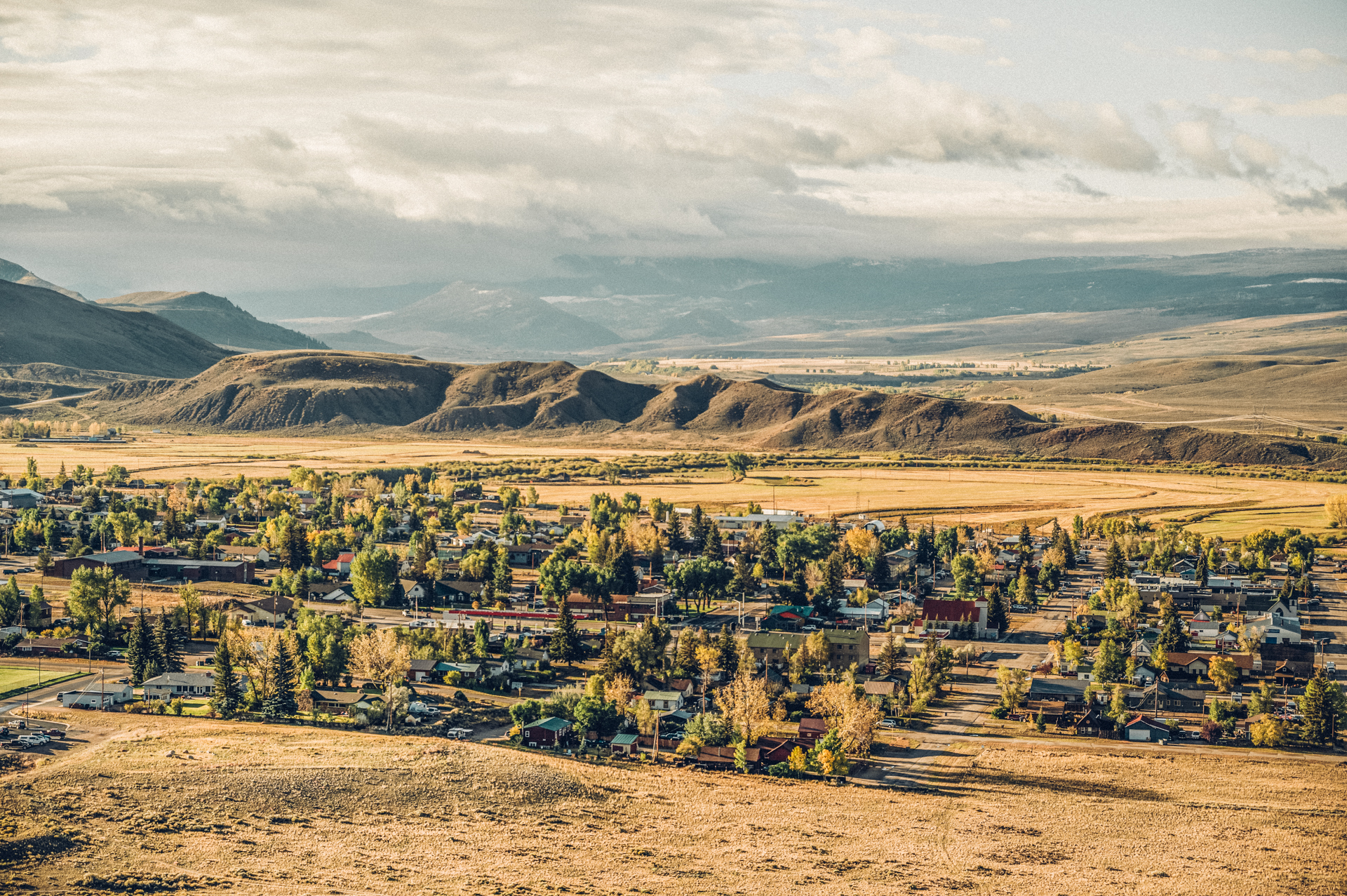 An aerial view of a small town in the mountains.