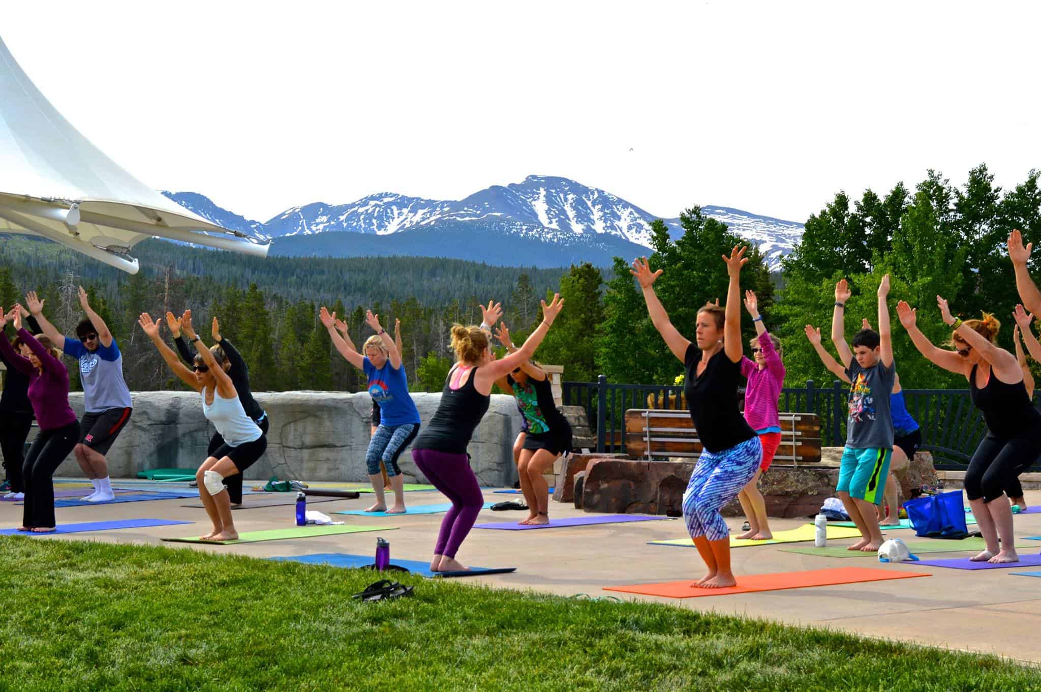 A group of people doing yoga.