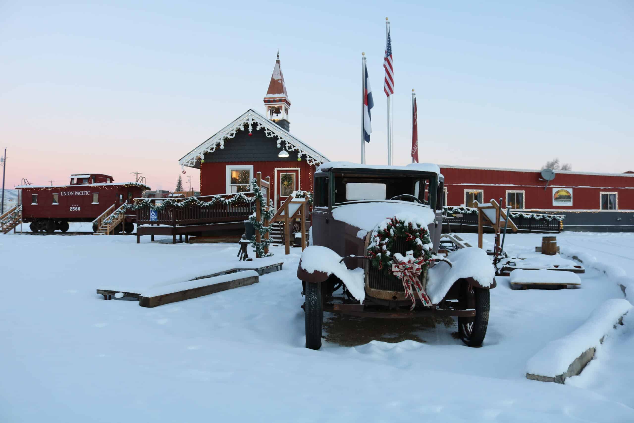 An old car parked in front of a building.