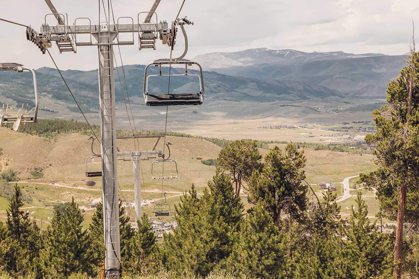 A ski lift with a person on it.