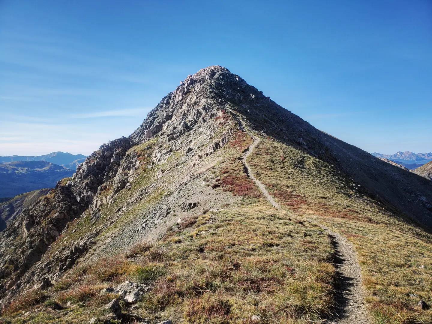 A trail leading up to the top of a mountain.